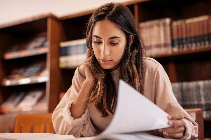 Female student studying in library