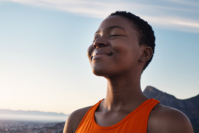 Smiling woman with eyes closed