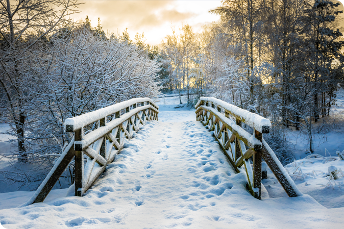 Snowy, wooden bridge in a winter day. Stare Juchy, Poland