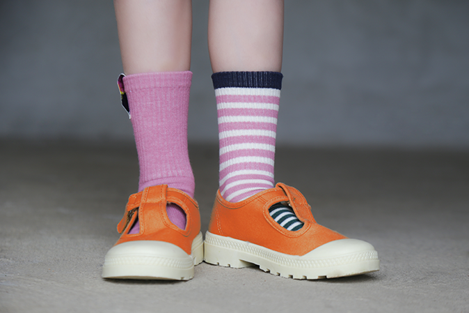 Young girl with mismatched socks