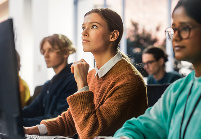 Law students looking up at a screen 