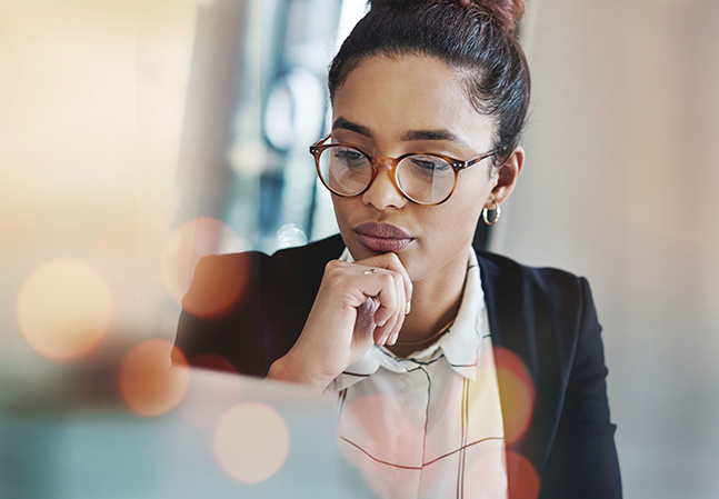 Business woman thinking and planning on computer