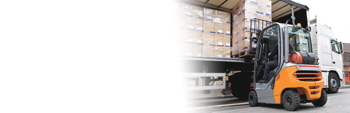 Forklift removing pallet of boxes off of a tractor trailer truck